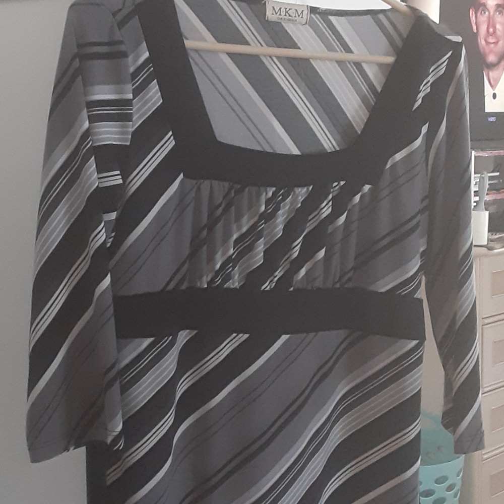 Black ,gray and white striped blouse.